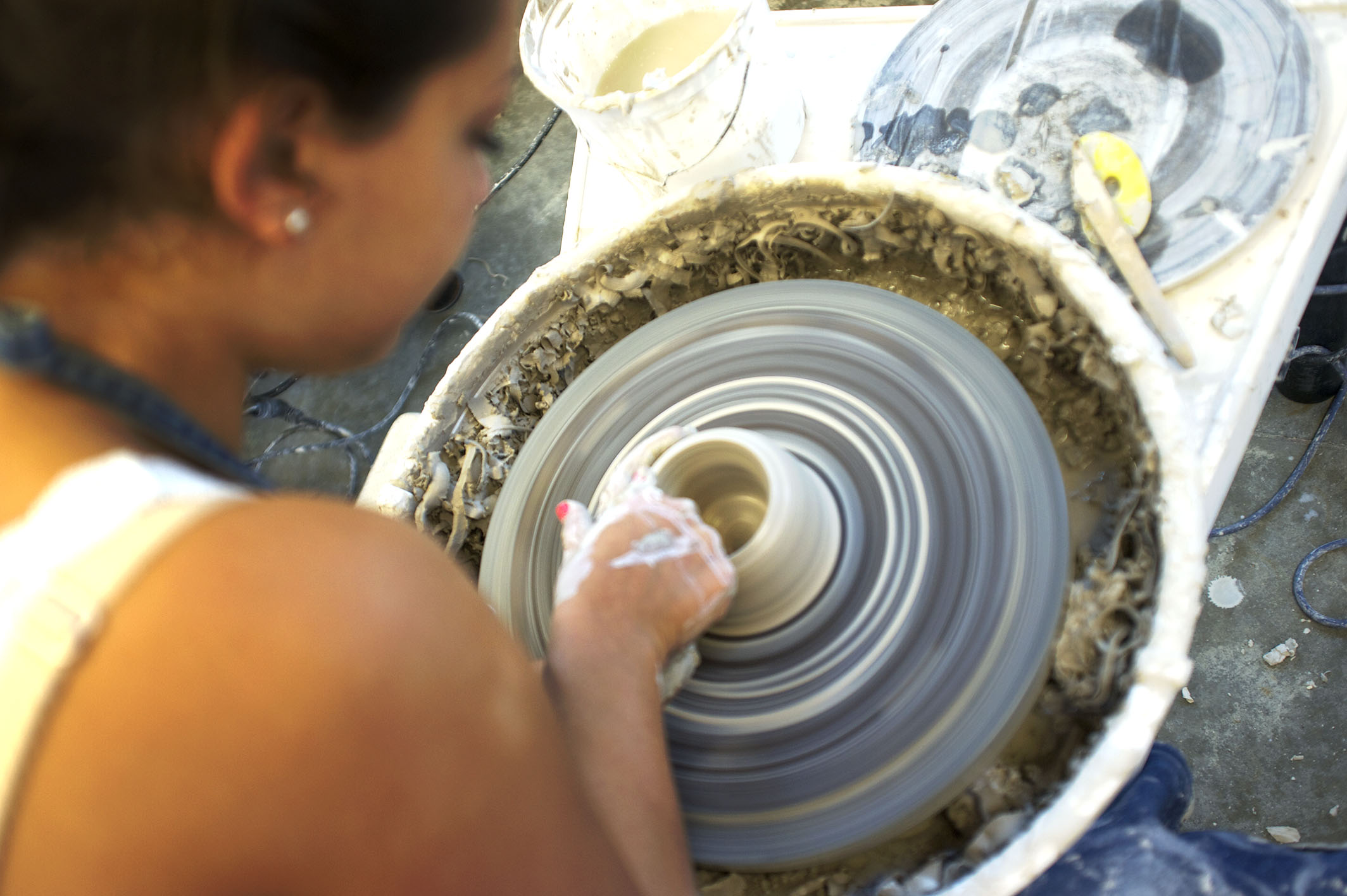 A women doing pottery in color