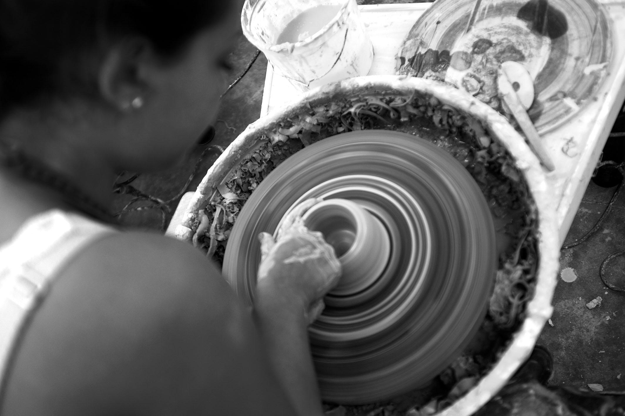 A women doing pottery in black and white